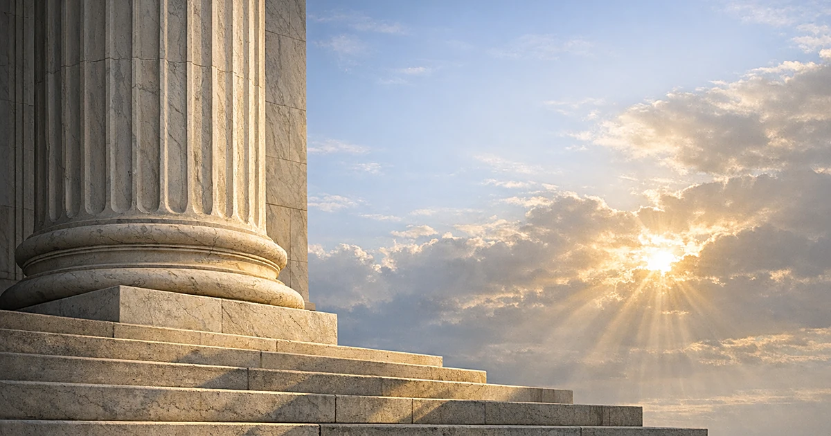 Abstract marble column representing justice with sunlight and blue sky